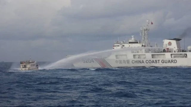 China’s coast guard fires water cannons at Philippine ships